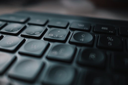 black computer keyboard in close up photography