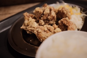 Close-up of a golden, crispy chicken fried steak served with creamy mashed potatoes and gravy