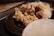 Close-up of a delicious golden fried chicken plate with fresh sides on a red and white tablecloth.