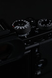 A close-up of a student adjusting camera settings.