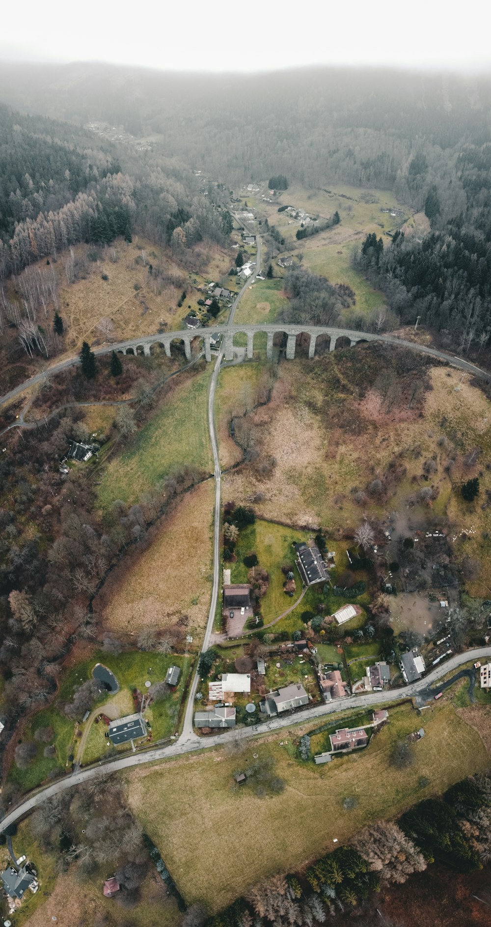 aerial view of city buildings and trees during daytime