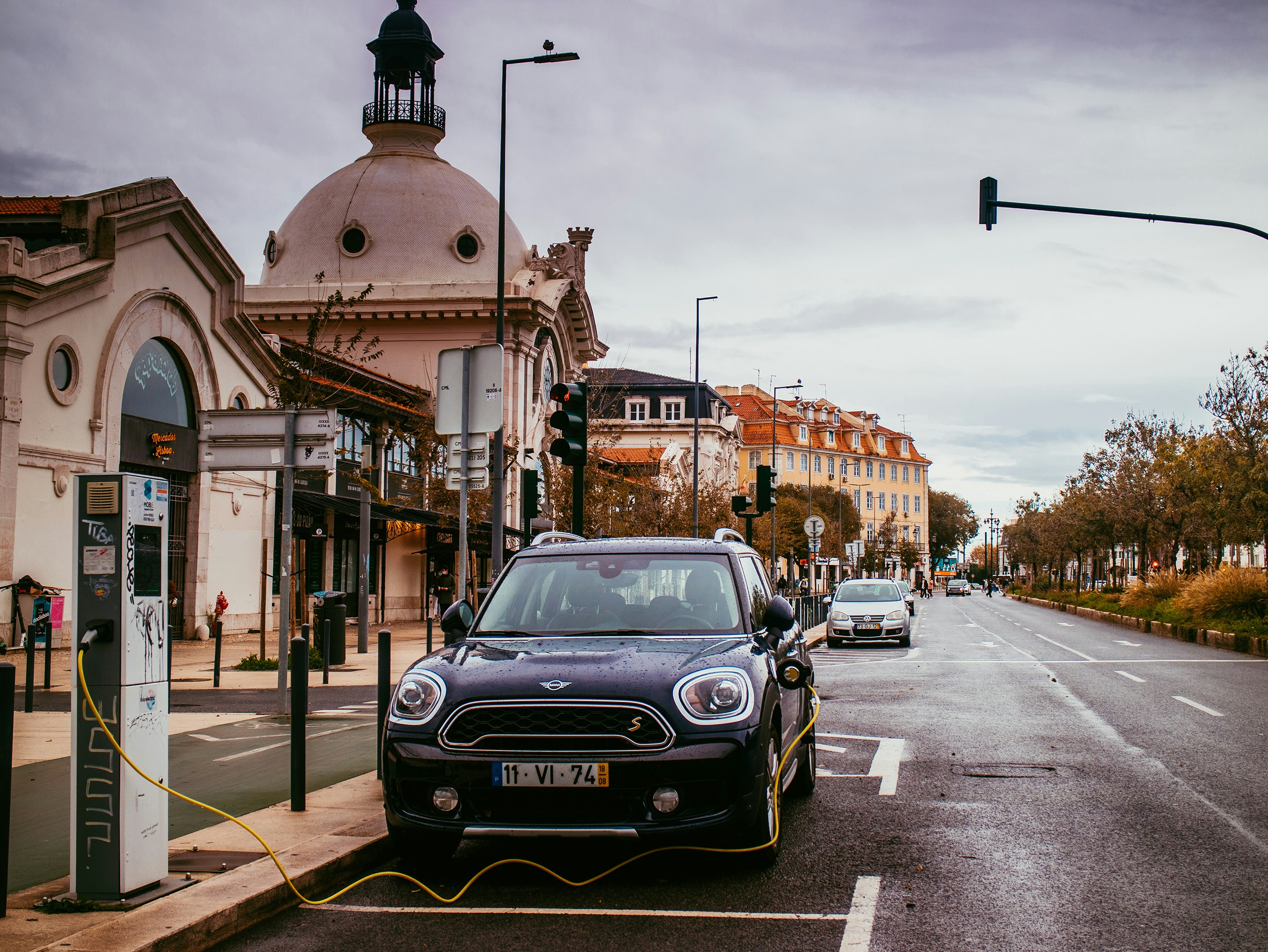 black car on road near building during daytime