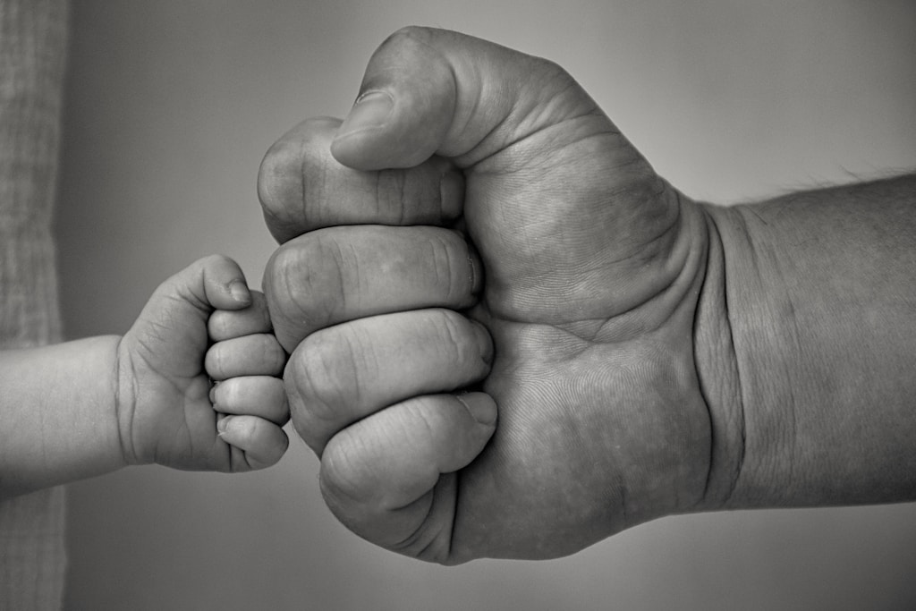 grayscale photo of persons hand