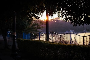 Sunset casting warm light over the landscaped gardens and walking paths in Vinhomes Ha Long Xanh.