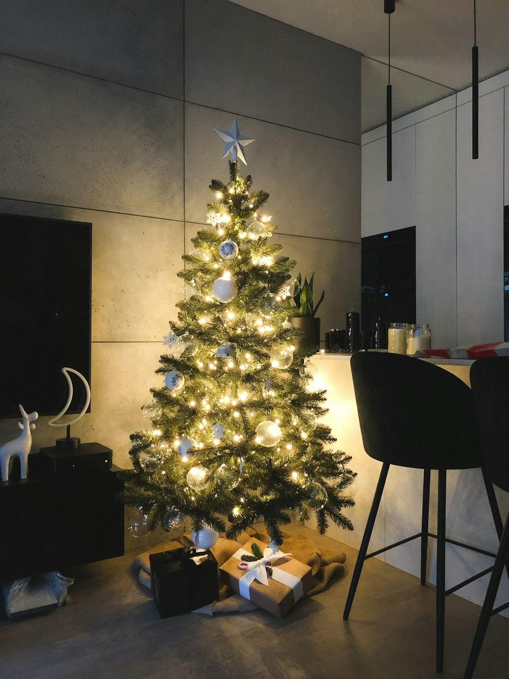 green christmas tree with white baubles