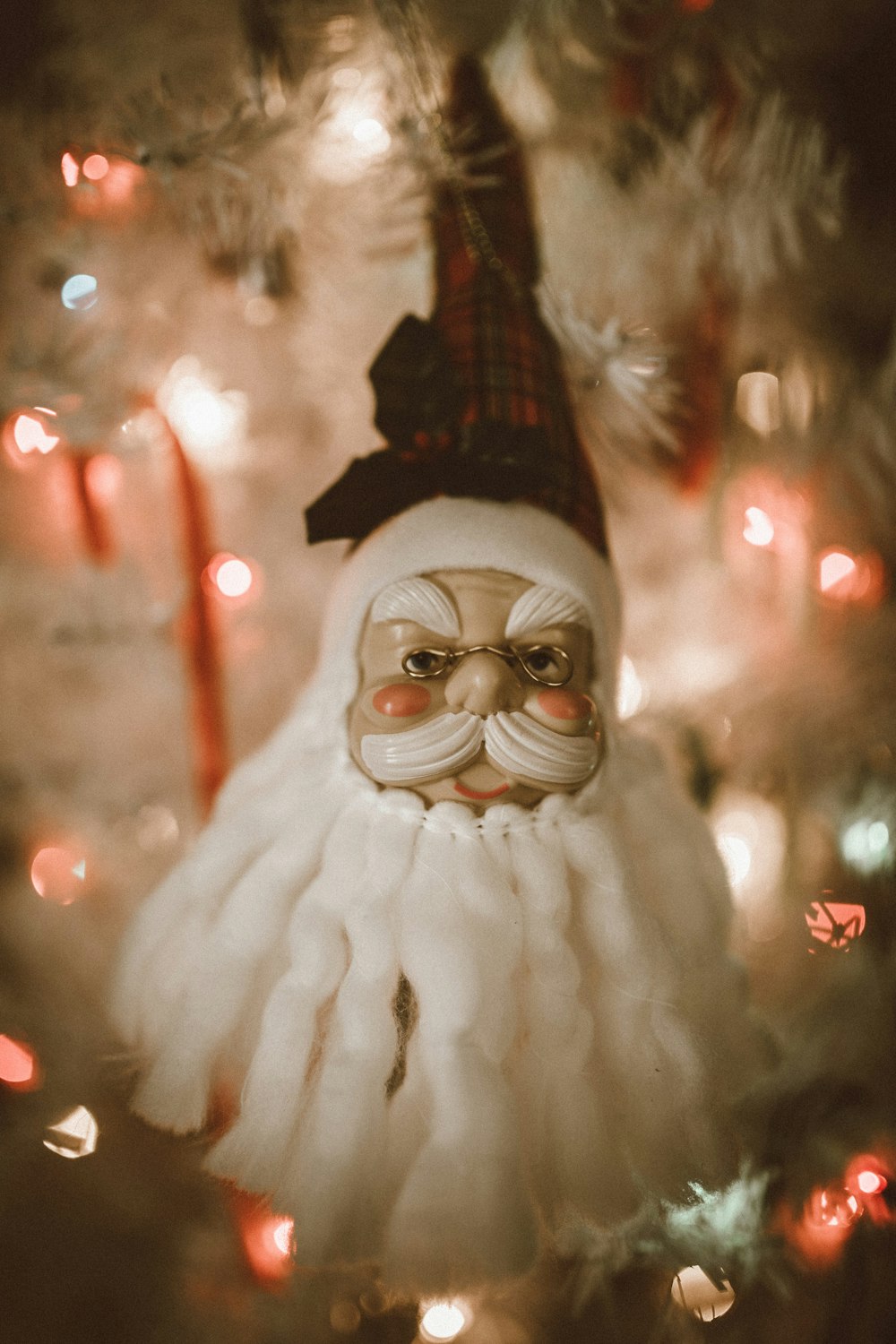 white snowman with black hat