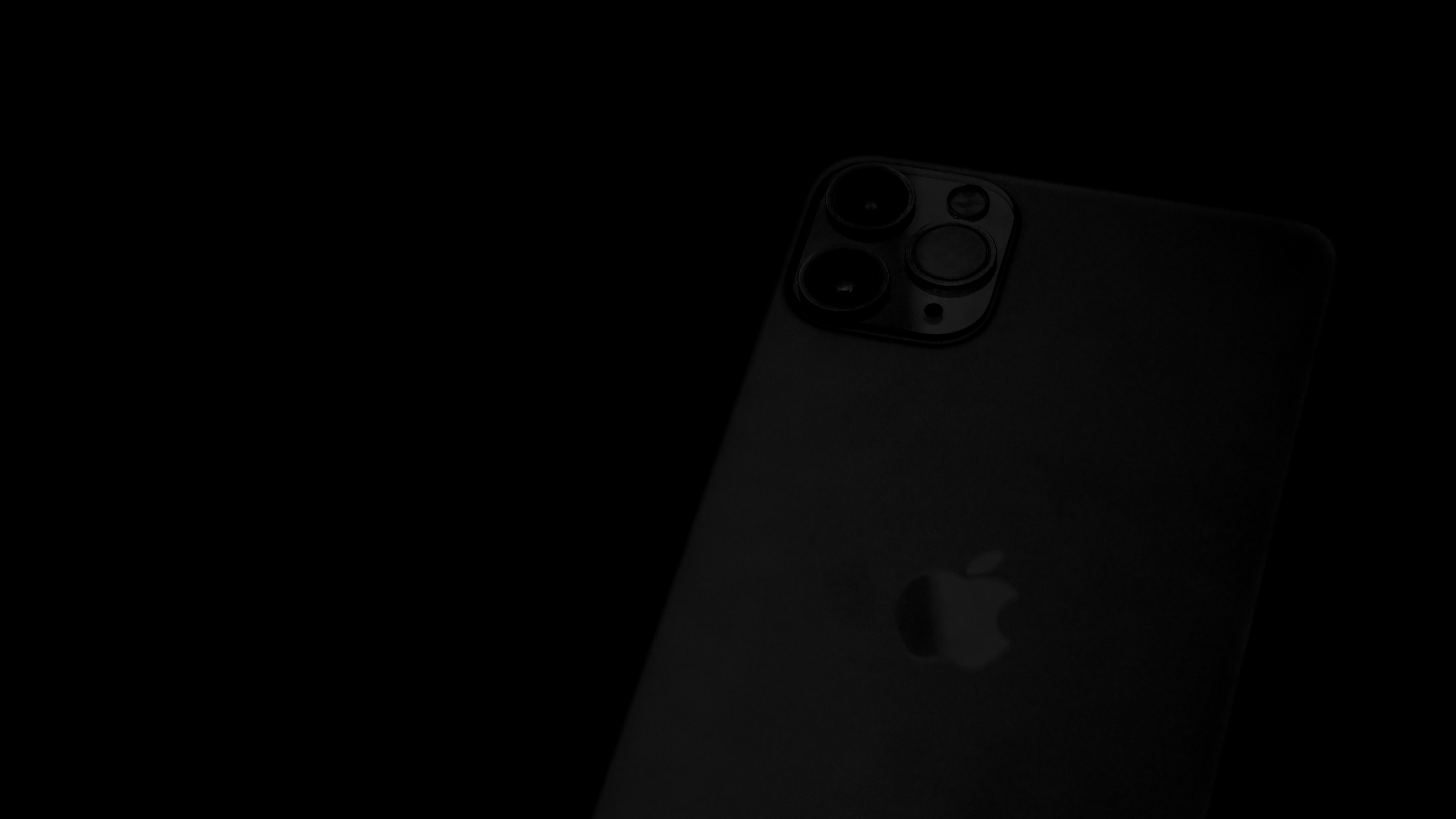 black iphone 7 on black surface