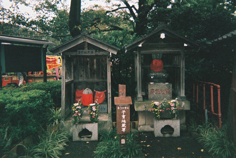 brown wooden house with green plants