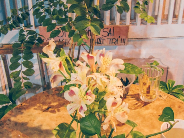 Customizable bouquet options displayed on a wooden table with soft natural light highlighting the colors.