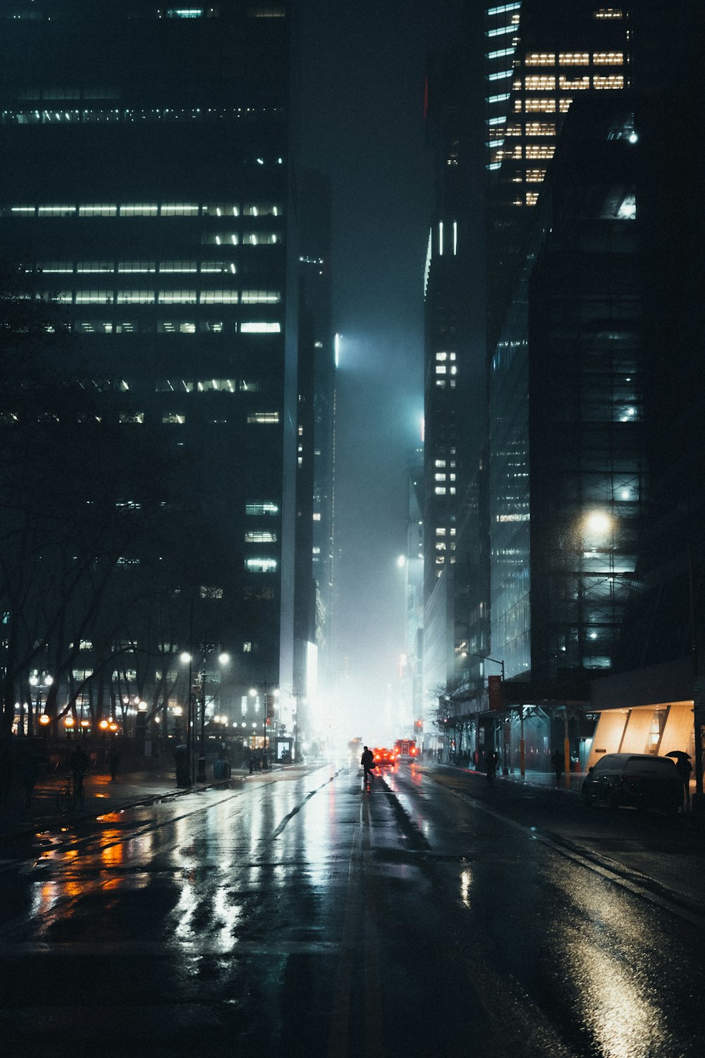 a city street at night in the rain