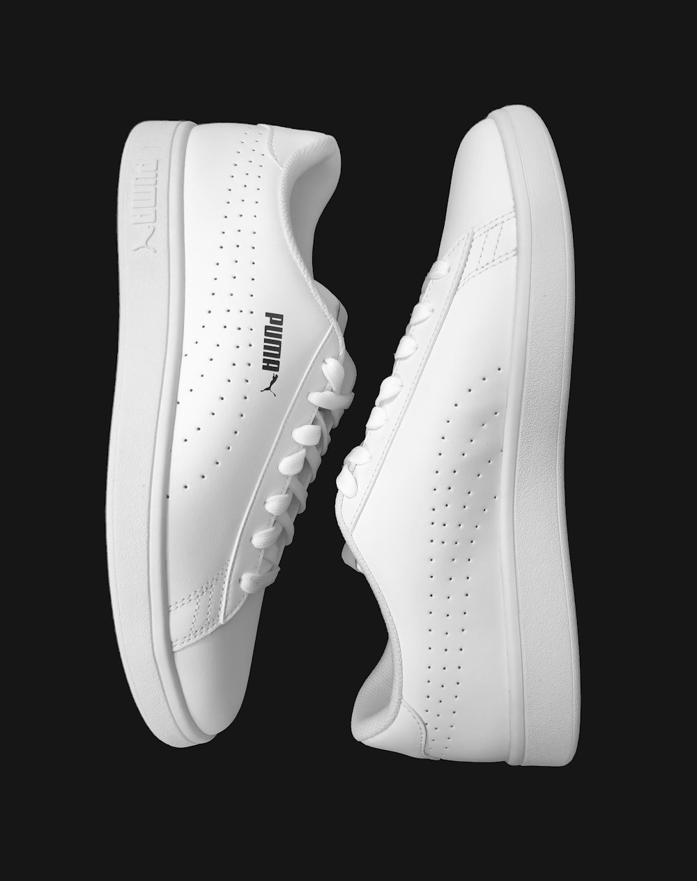 white nike athletic shoes on white background