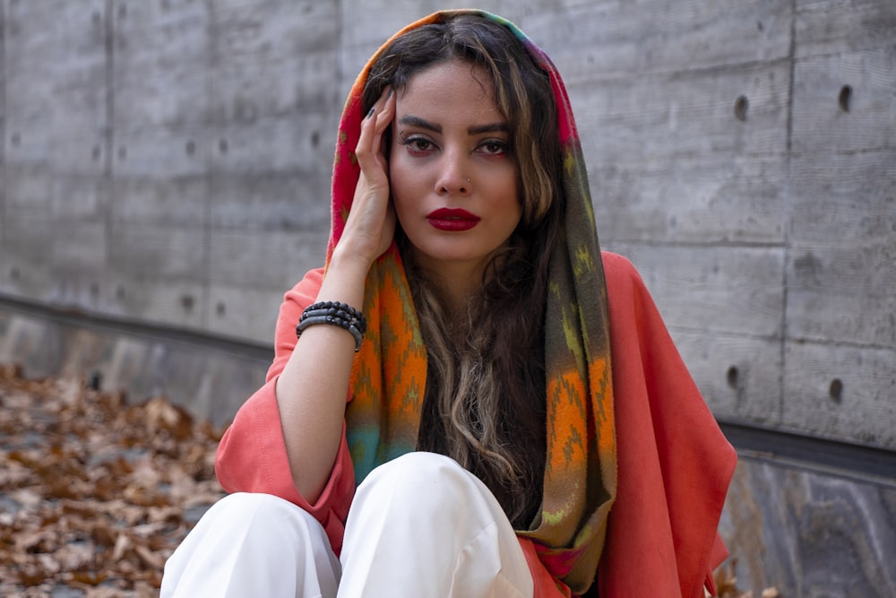 woman in red and green scarf