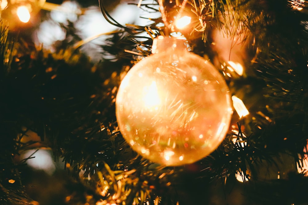 gold baubles on green christmas tree