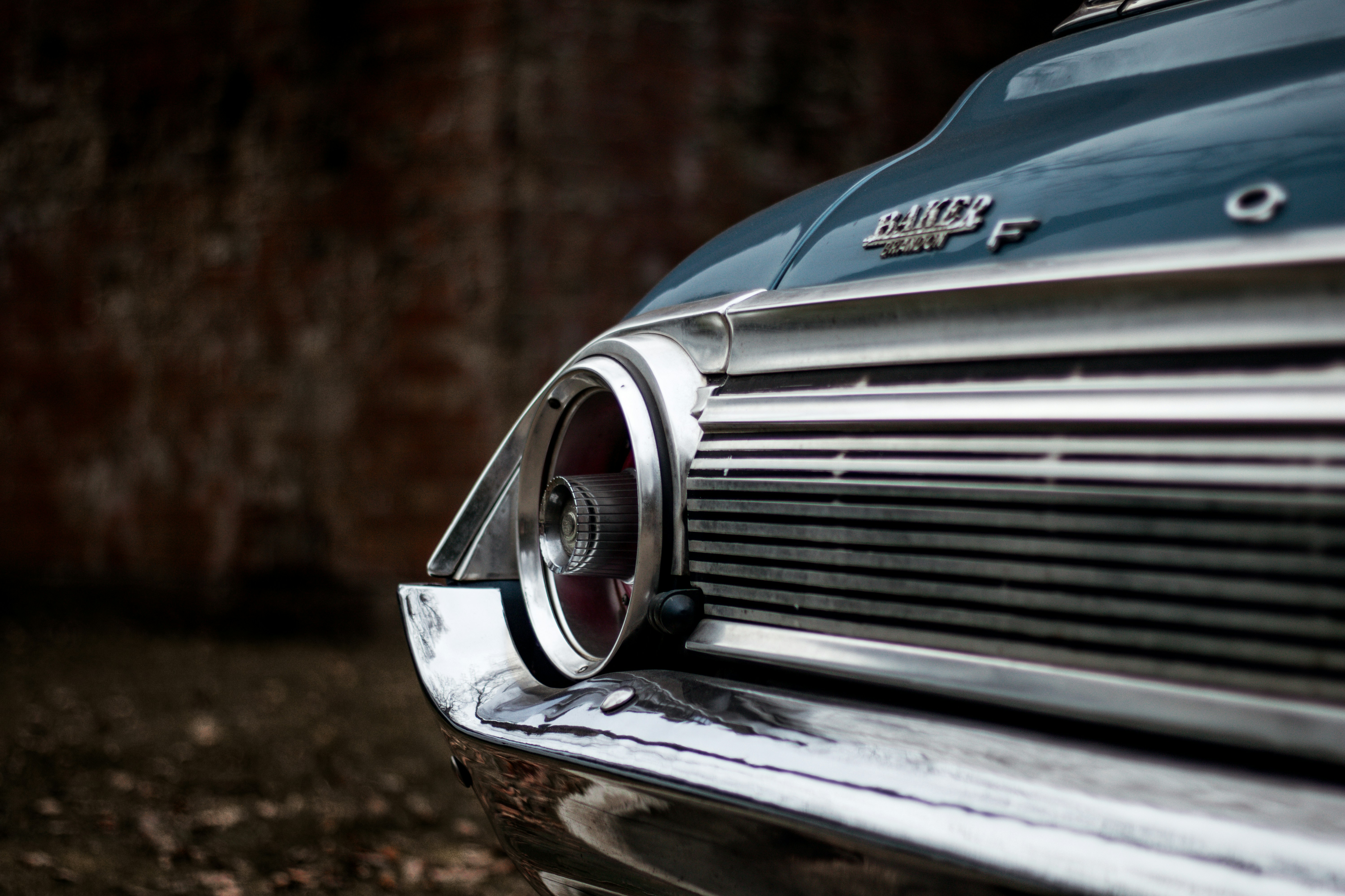 blue and silver car in tilt shift lens