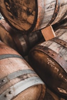 brown wooden barrels on brown wooden floor