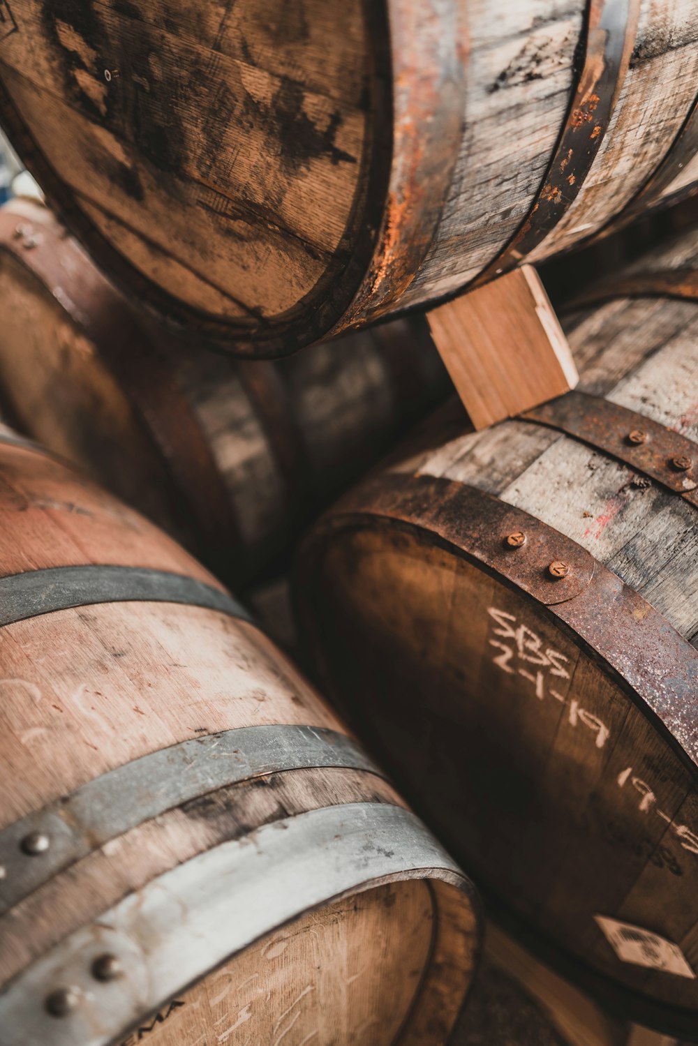 brown wooden barrels on brown wooden floor