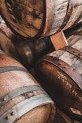 brown wooden barrels on brown wooden floor
