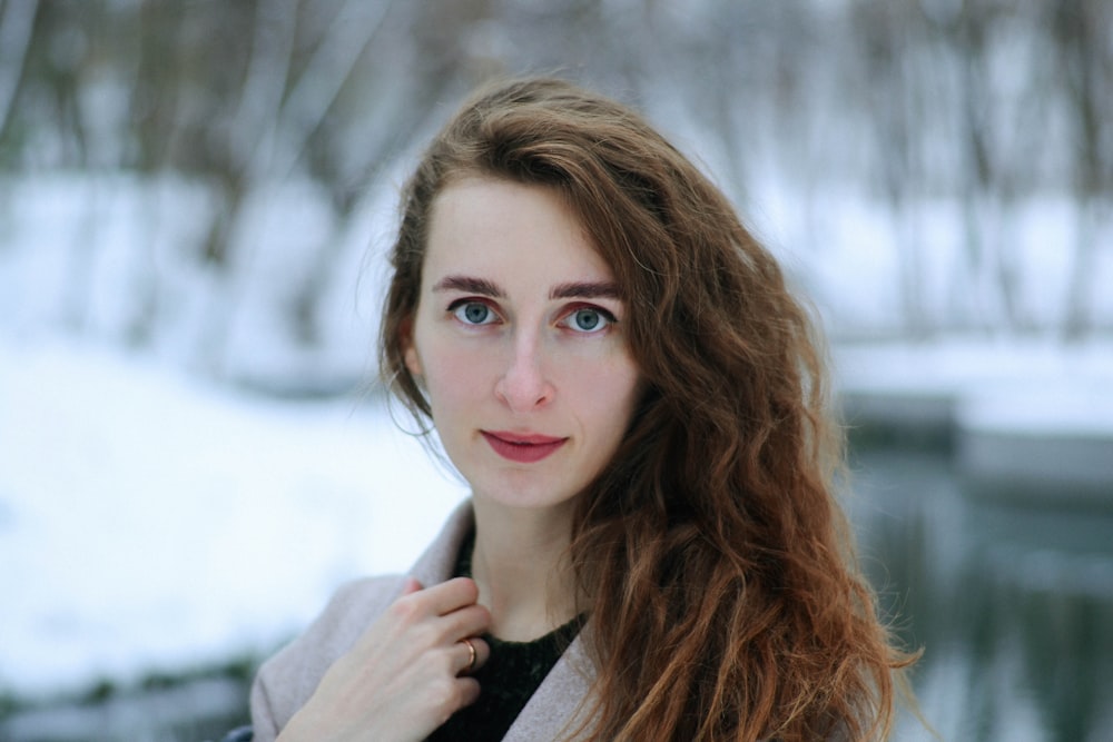 woman in black and gray coat