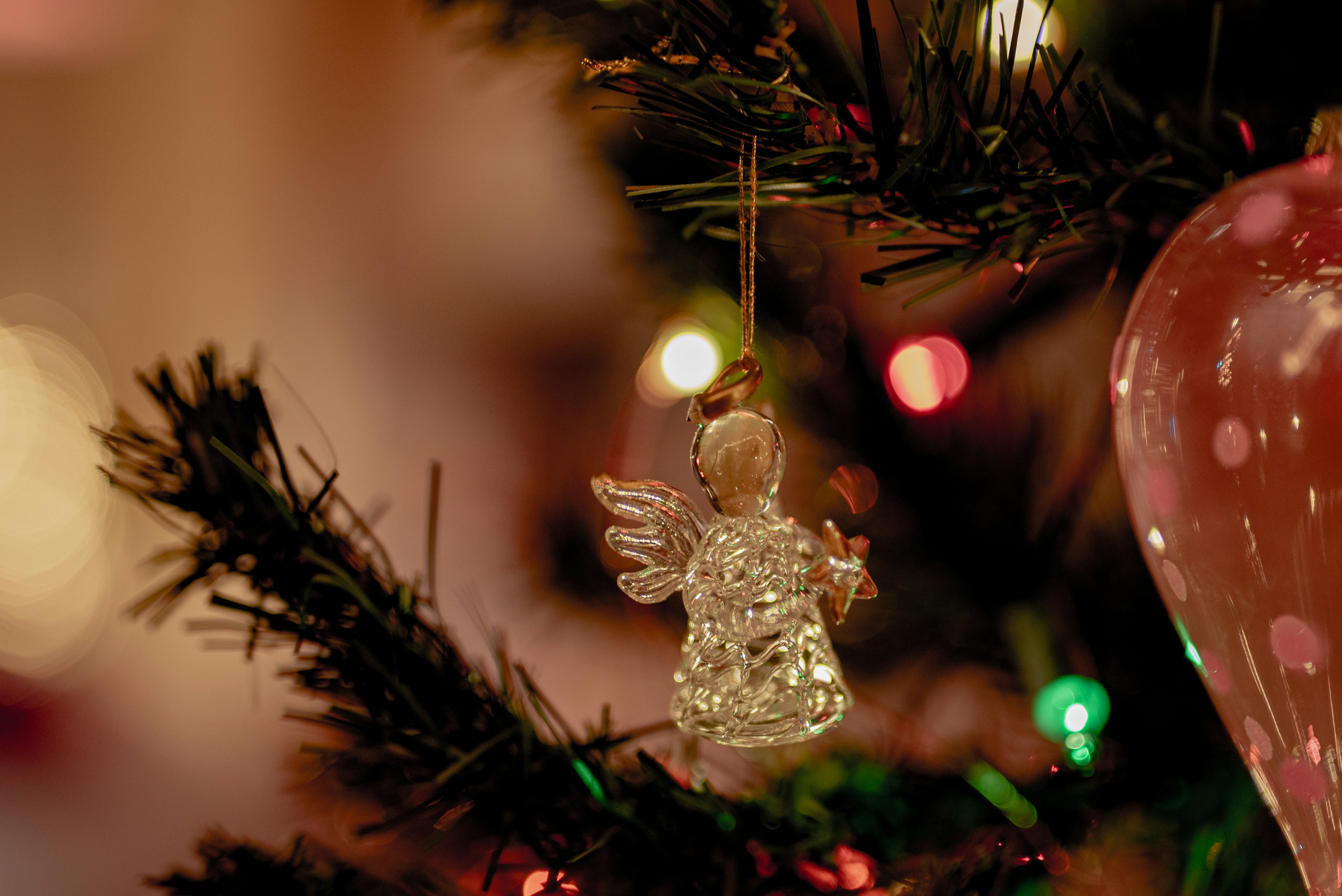 silver christmas tree ornament on green christmas tree