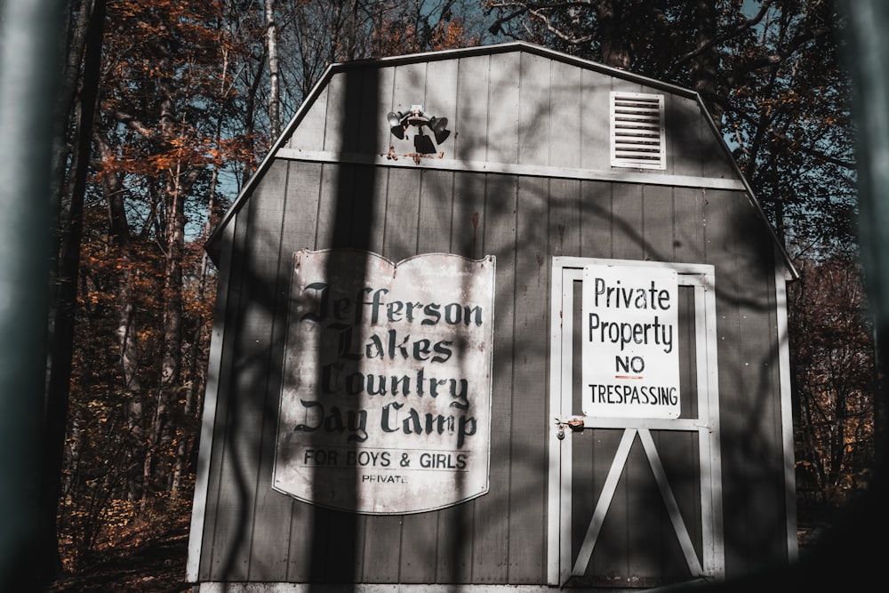 a barn with a sign on the side of it