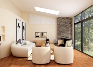 white sofa set on brown wooden parquet floor