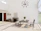 Modern dining table set in a stylish, well-lit room with minimalist decor