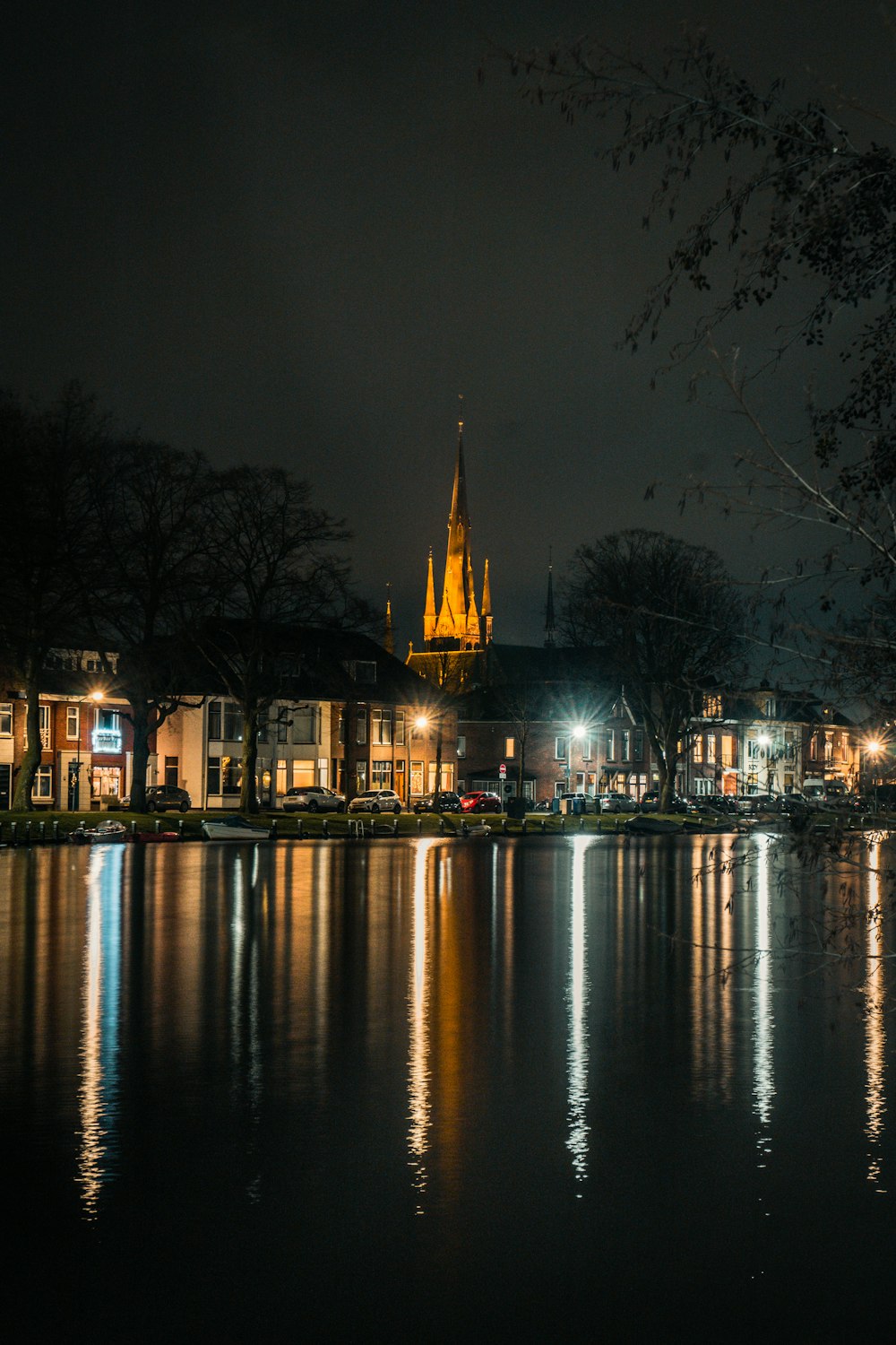 brown building near body of water during night time