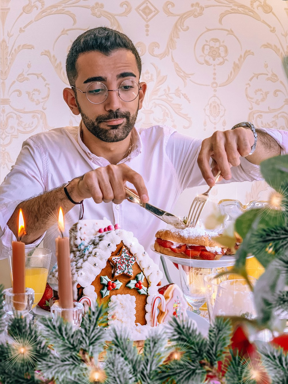 man in white crew neck t-shirt holding fork and eating cake