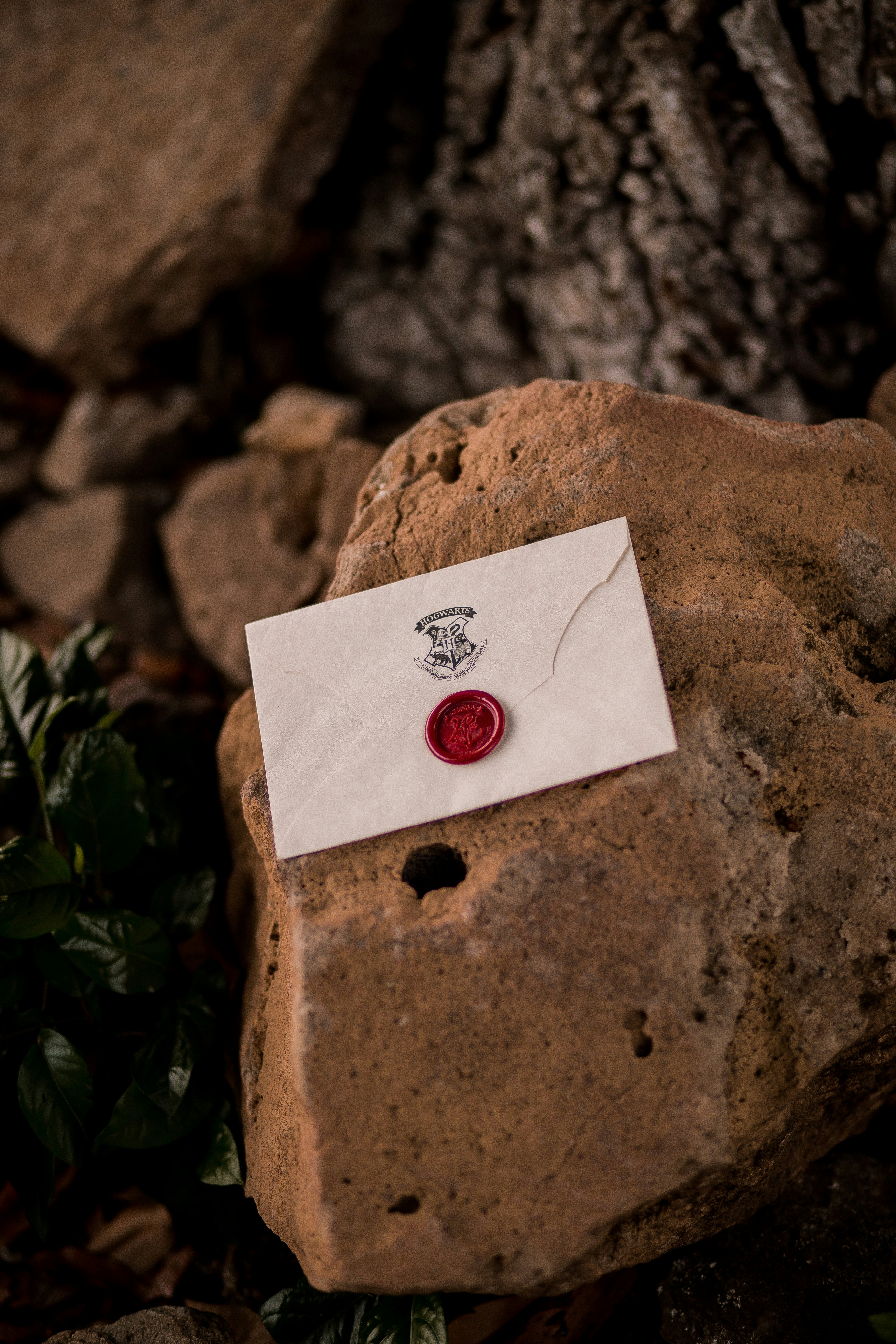 white and red heart card on brown stone