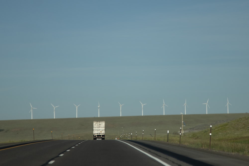 gray asphalt road under blue sky during daytime