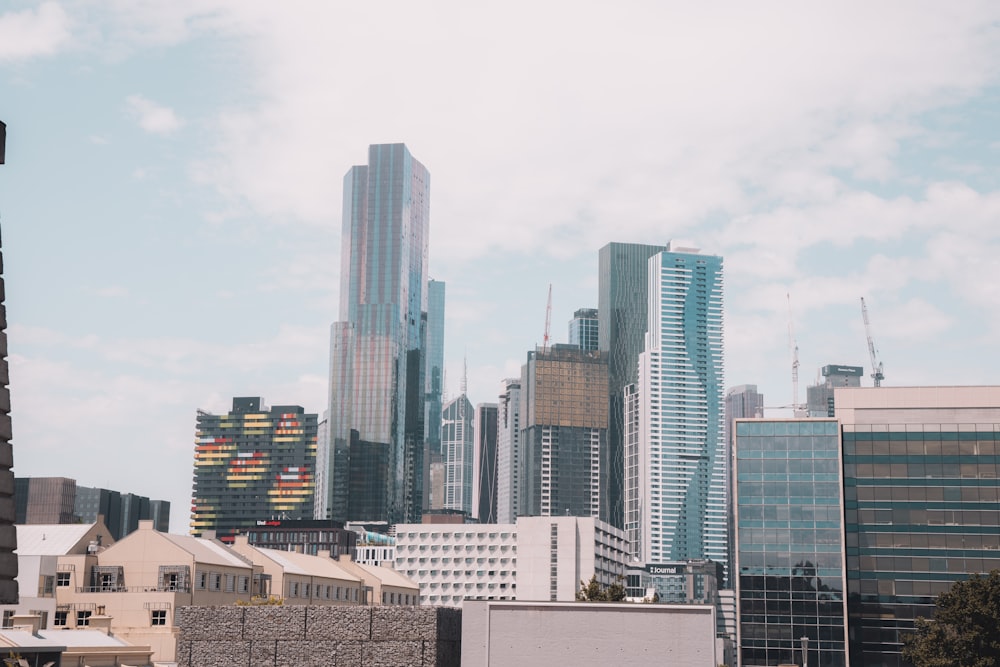 white and gray concrete buildings under white sky during daytime