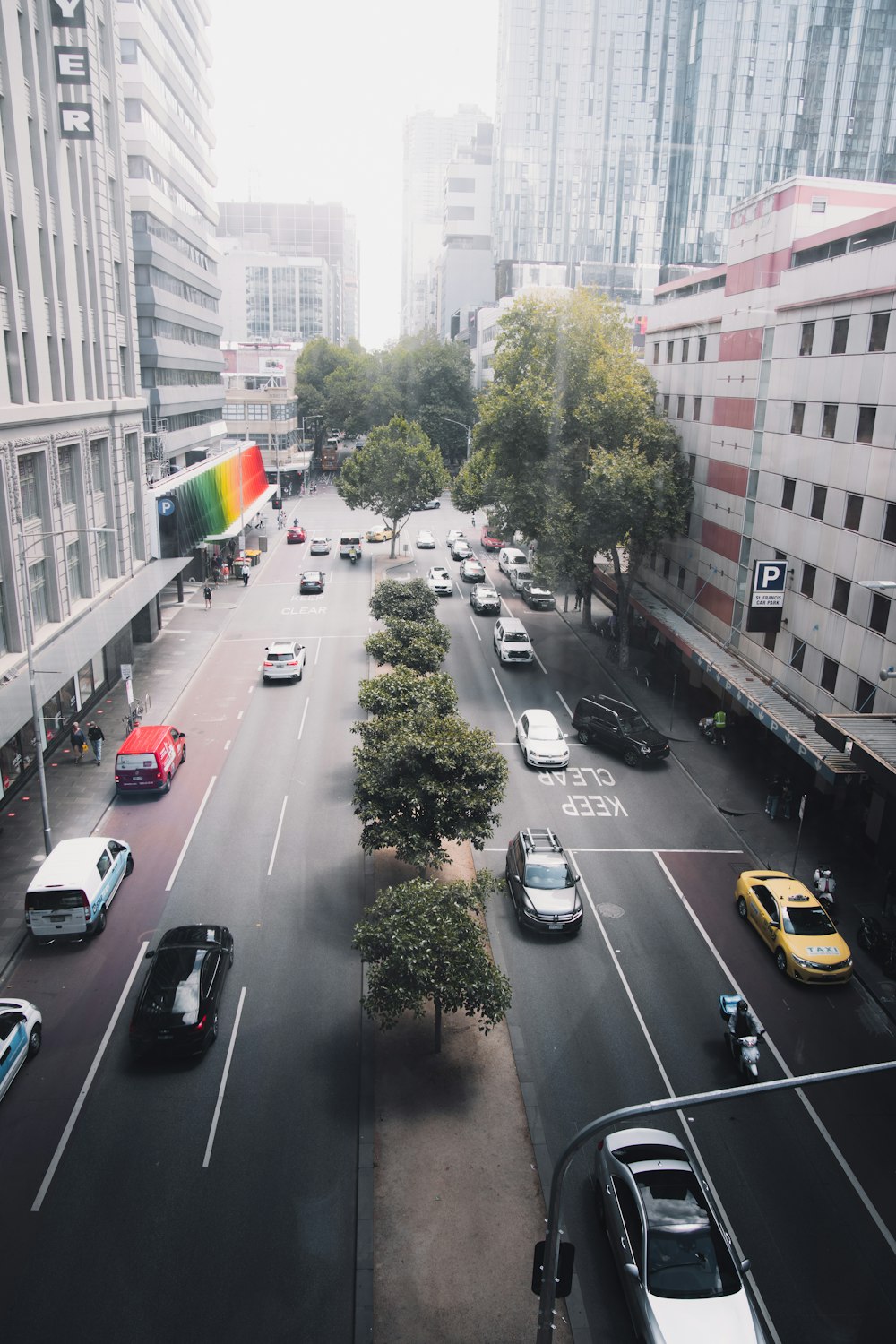 cars on road near buildings during daytime