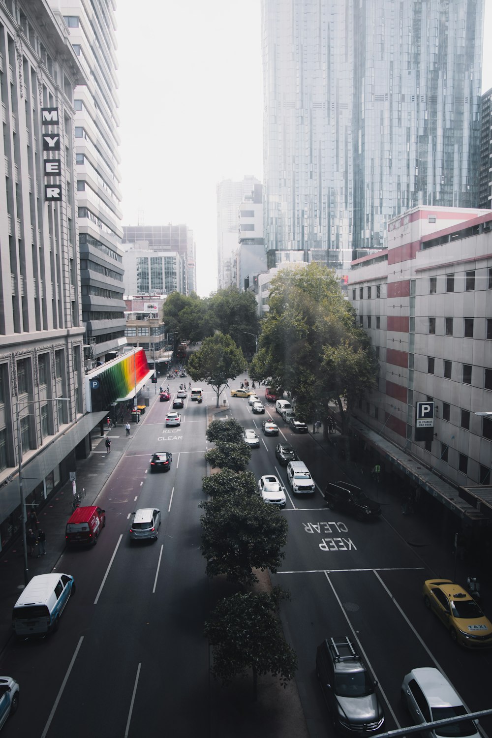 cars on road near buildings during daytime