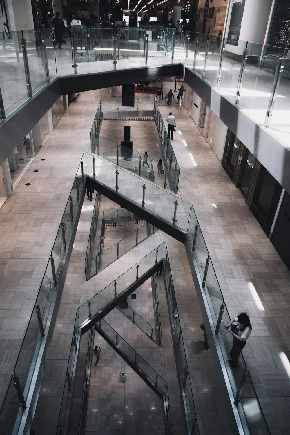 people walking on brown wooden floor