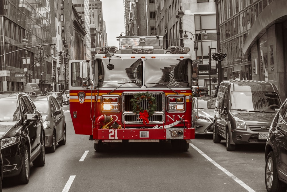 red and white truck on road during daytime