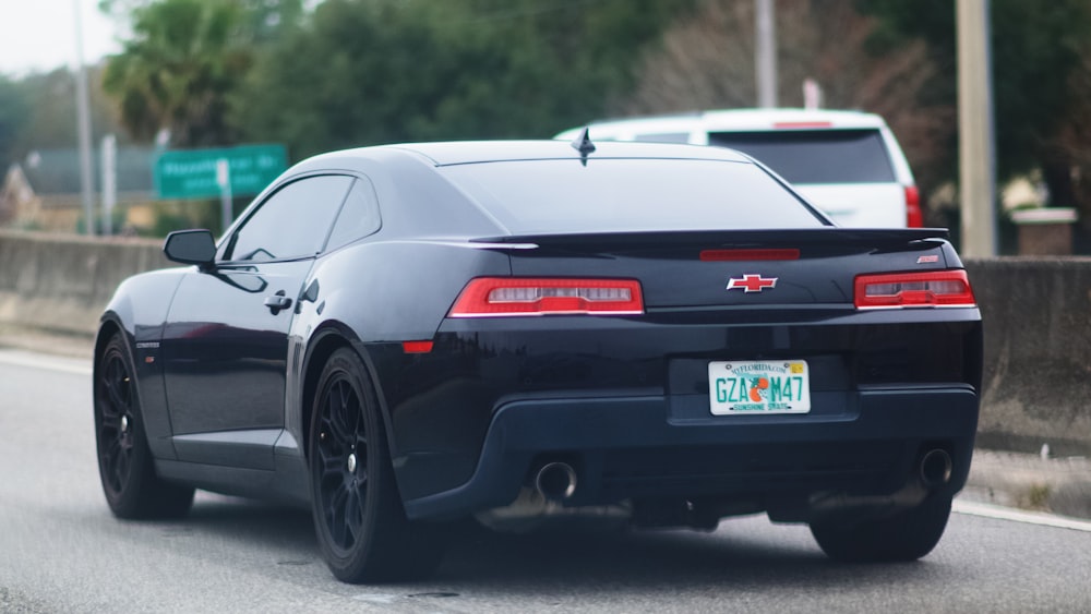 black honda sedan on road during daytime