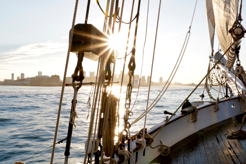 white and brown sail boat on sea during daytime