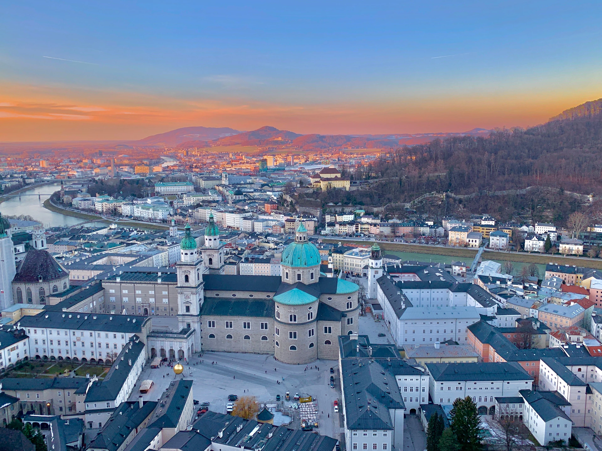 woman wearing yellow long-sleeved dress under white clouds and blue sky during daytime