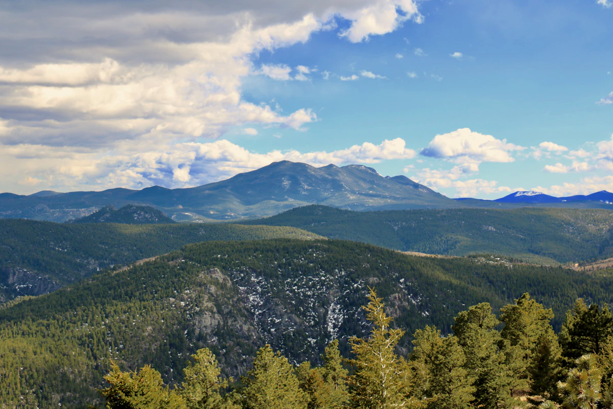 Forested foothills and mountain ridges in the Boulder area
