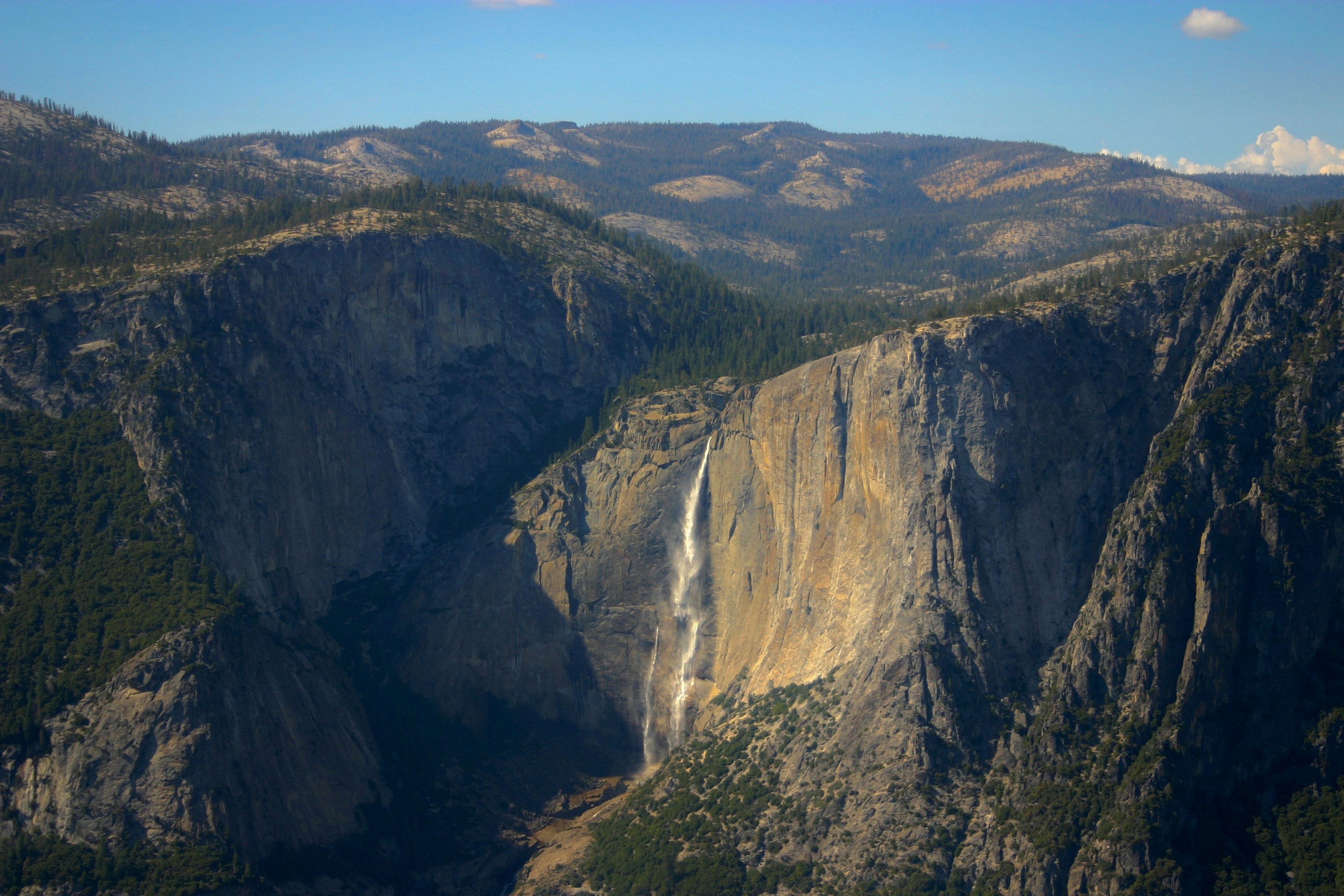 brown rocky mountain under blue sky during daytime