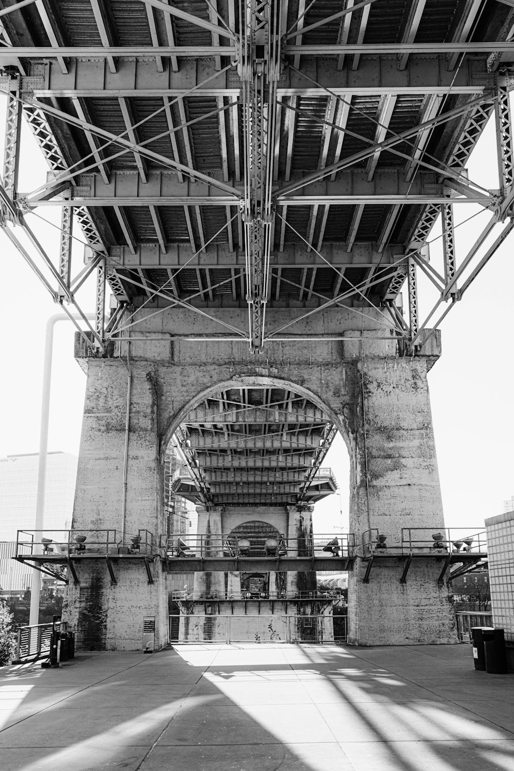 grayscale photo of bridge over river