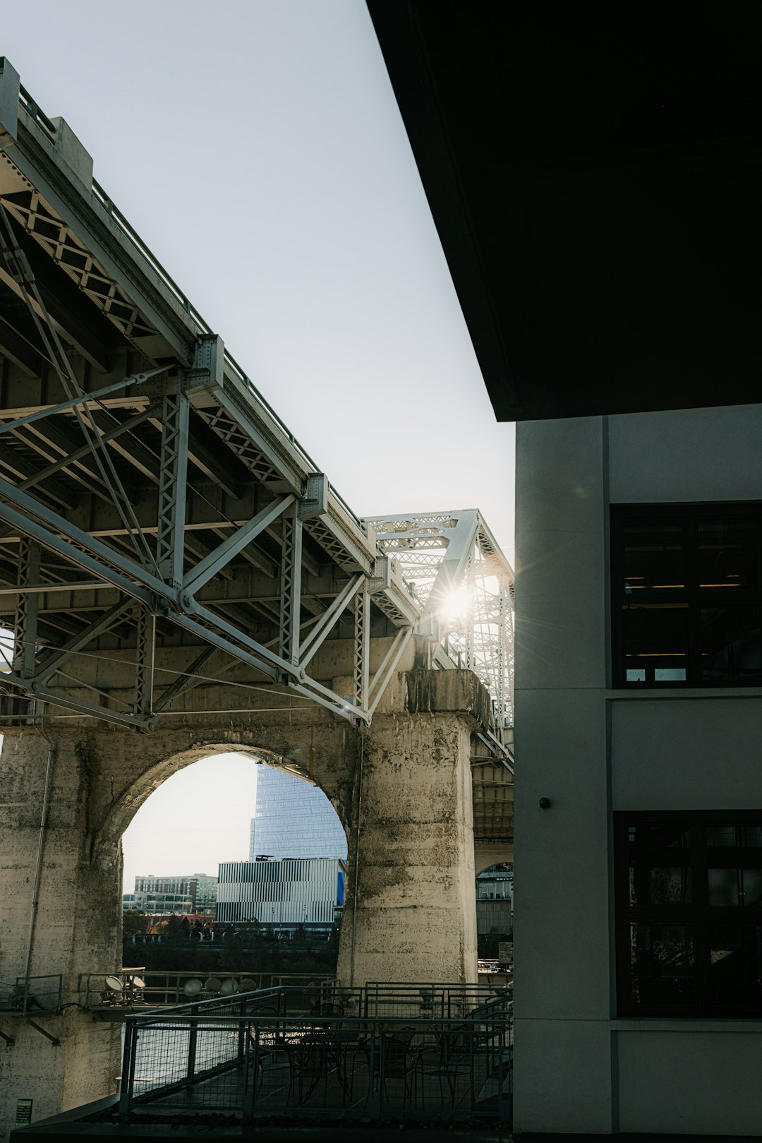 white and brown concrete bridge under white sky during daytime