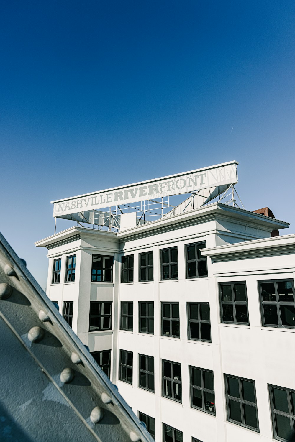 white concrete building under blue sky during daytime