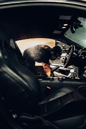 man in black t-shirt driving car