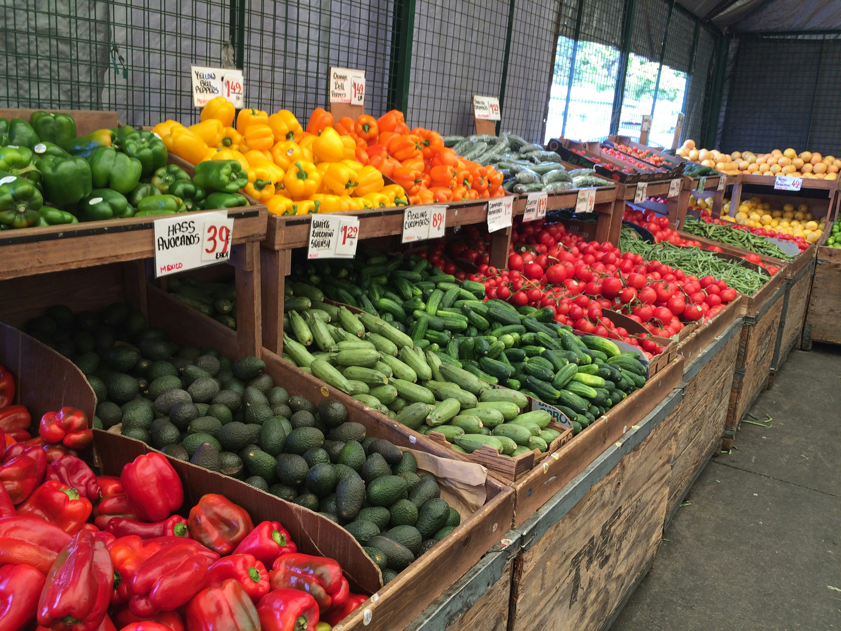 Fresh colorful vegetables and fruits displayed at a local Filipino market stall