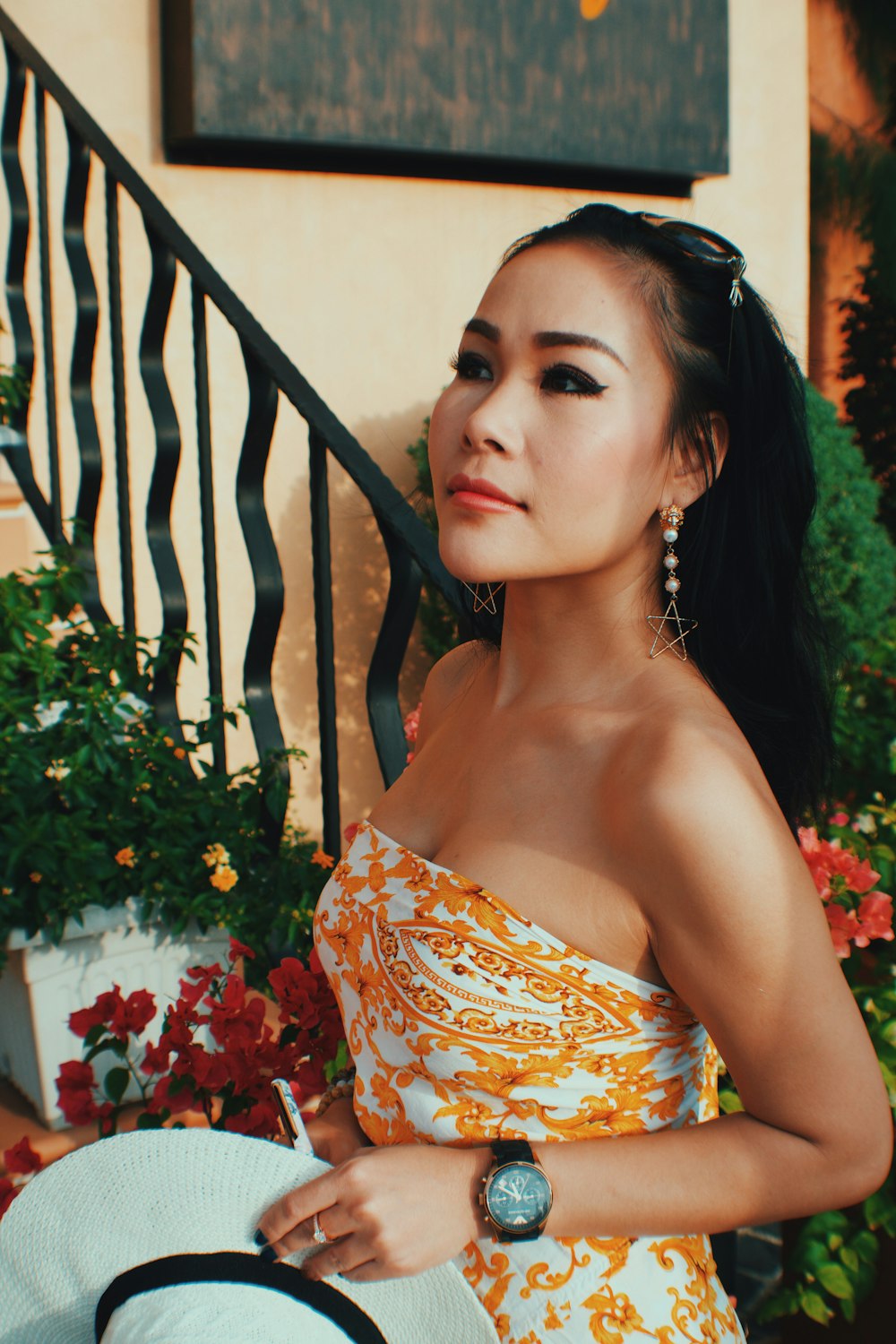 woman in blue and white floral tube dress