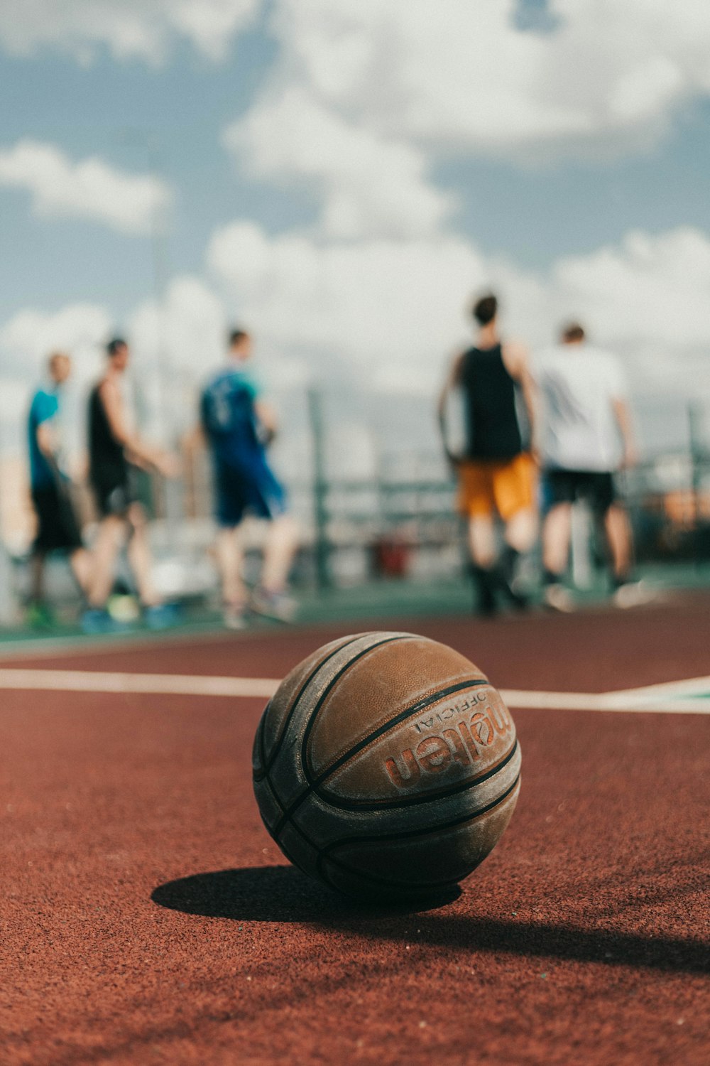 brown basketball on brown field during daytime