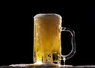 clear glass beer mug with beer