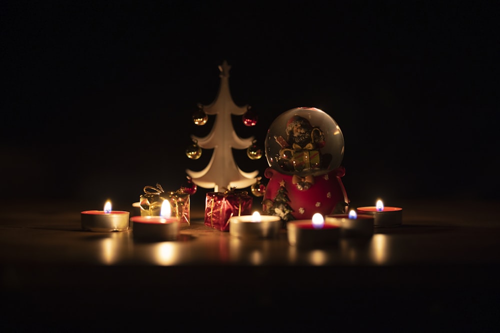 gold and red lighted candles on table