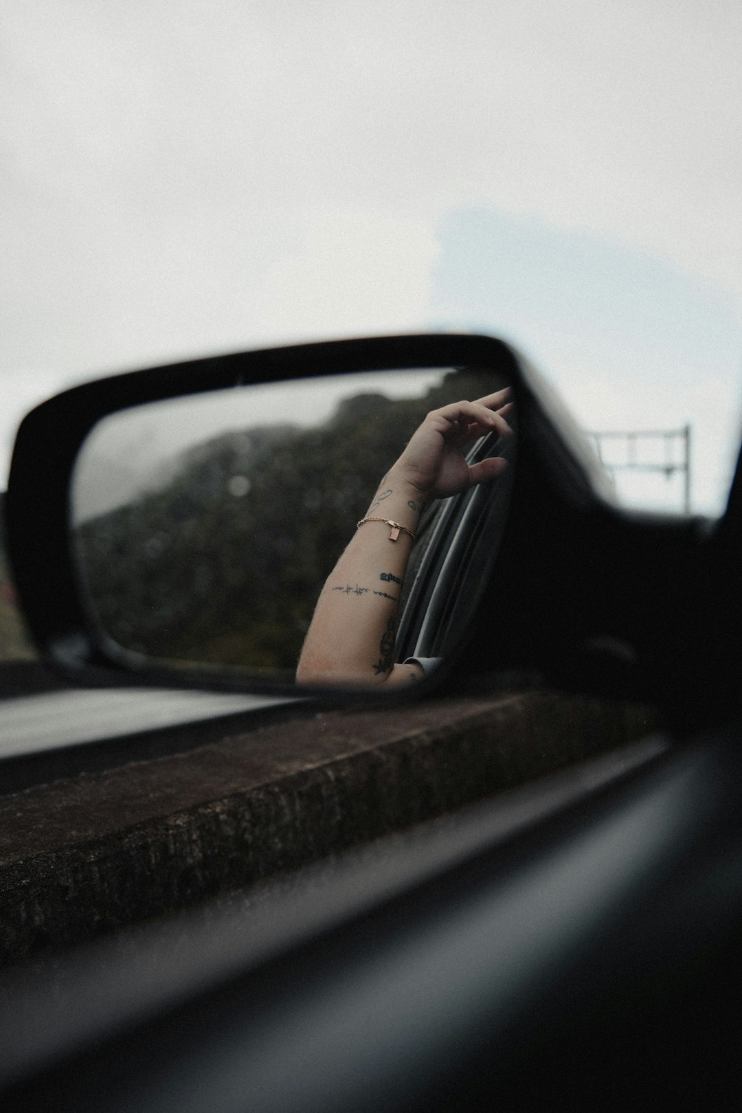 car side mirror showing car